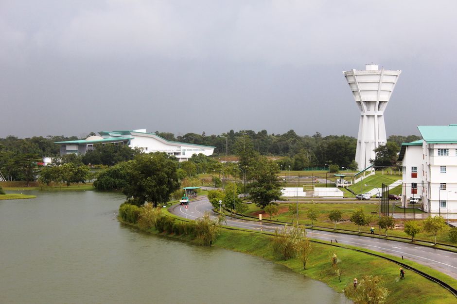 A beautiful campus with lush greenery and a calm lake in Kota Samarahan, Sarawak, Malaysia.